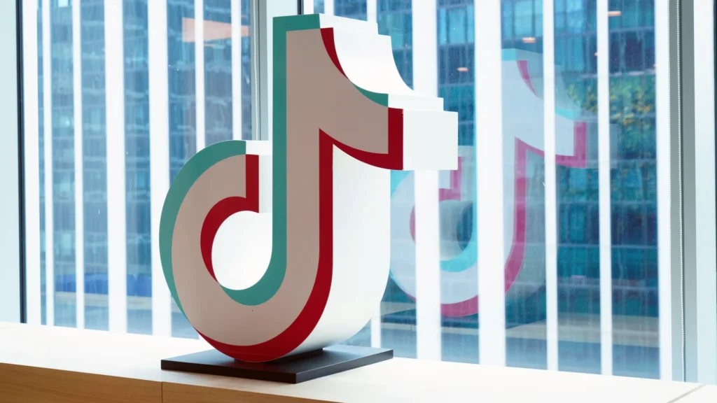 Facebook and Instagram logos beside the TikTok logo illustrating Meta's advertising ban in seven markets